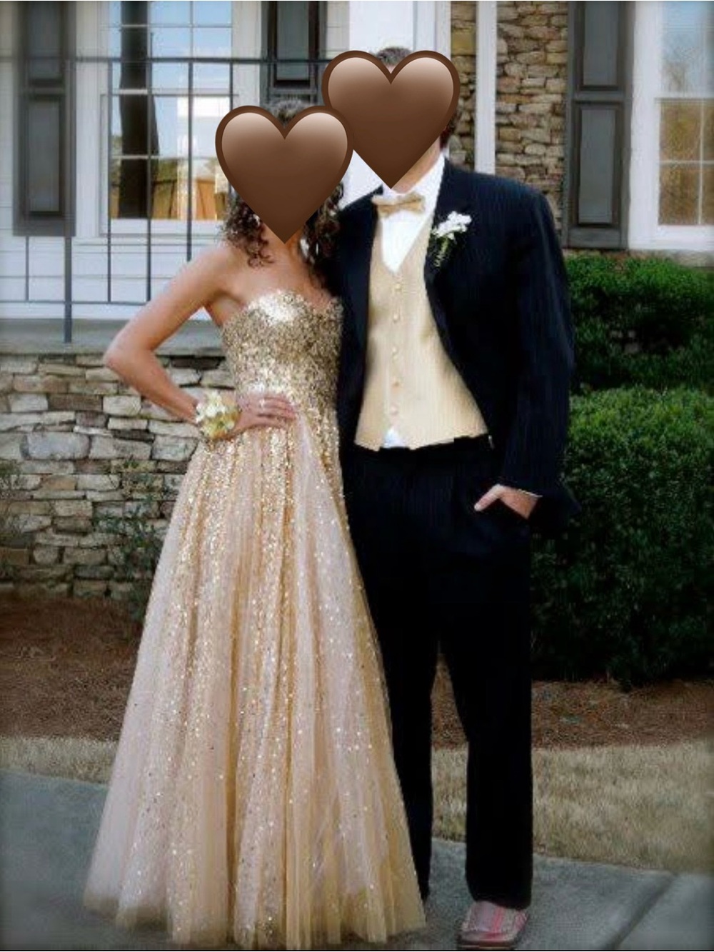 Woman’s gold sequined strapless formal gown